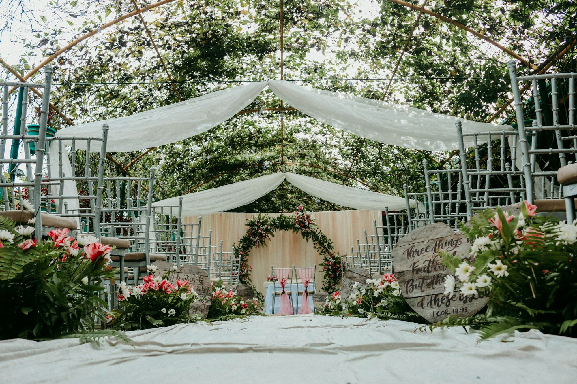 Wedding ceremony set beneath trees