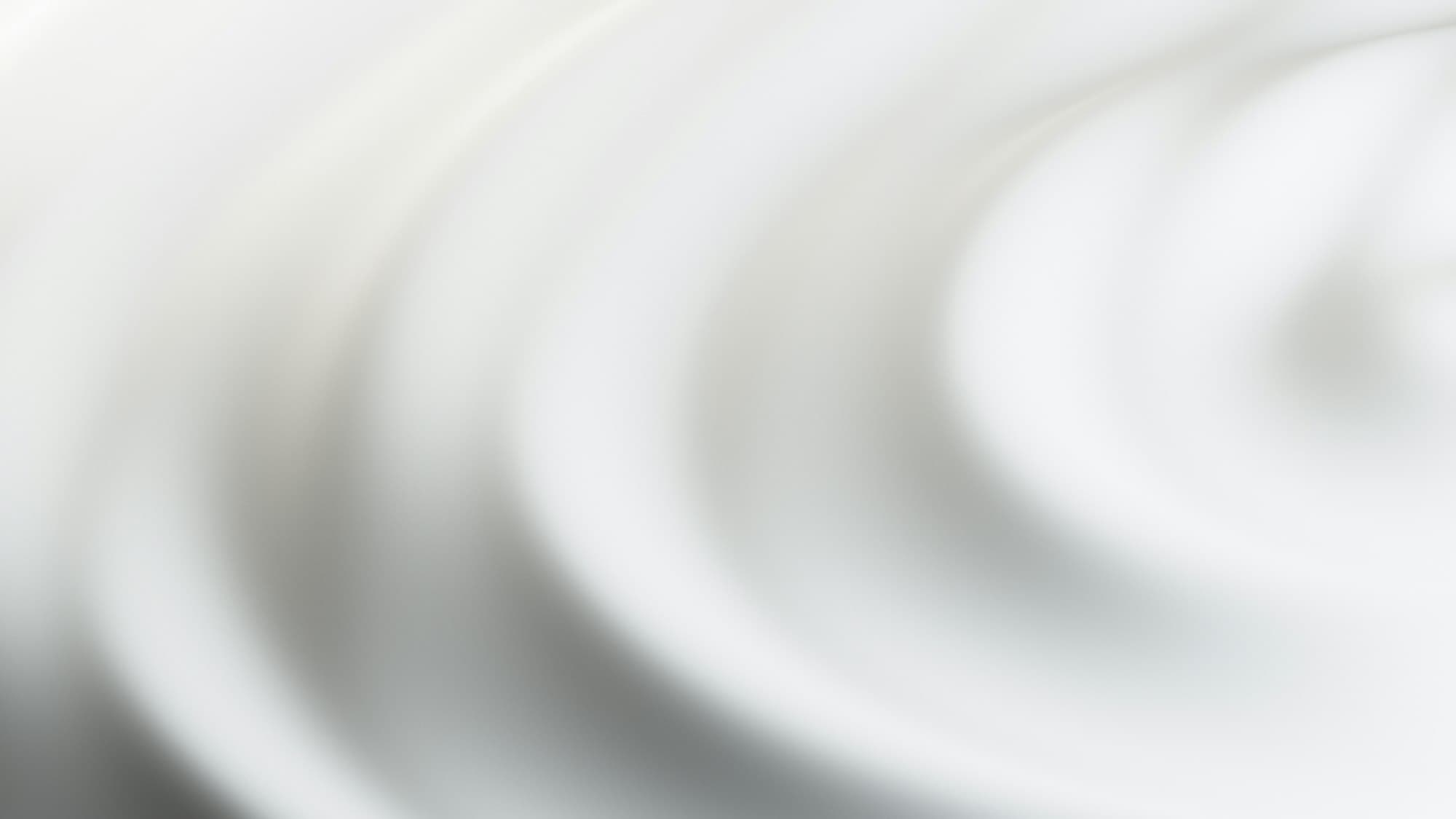 Soft swirl of white cream in close-up