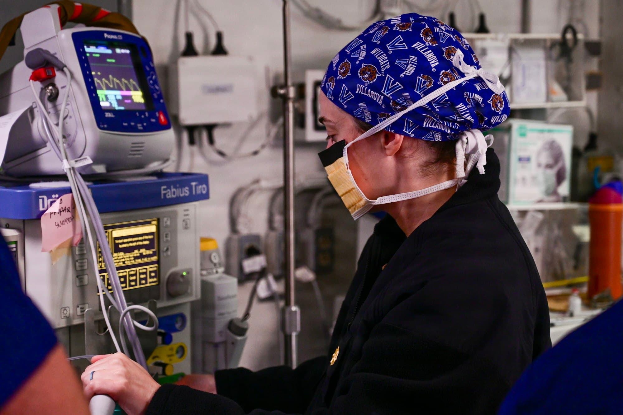 Nurse checking a patient monitor
