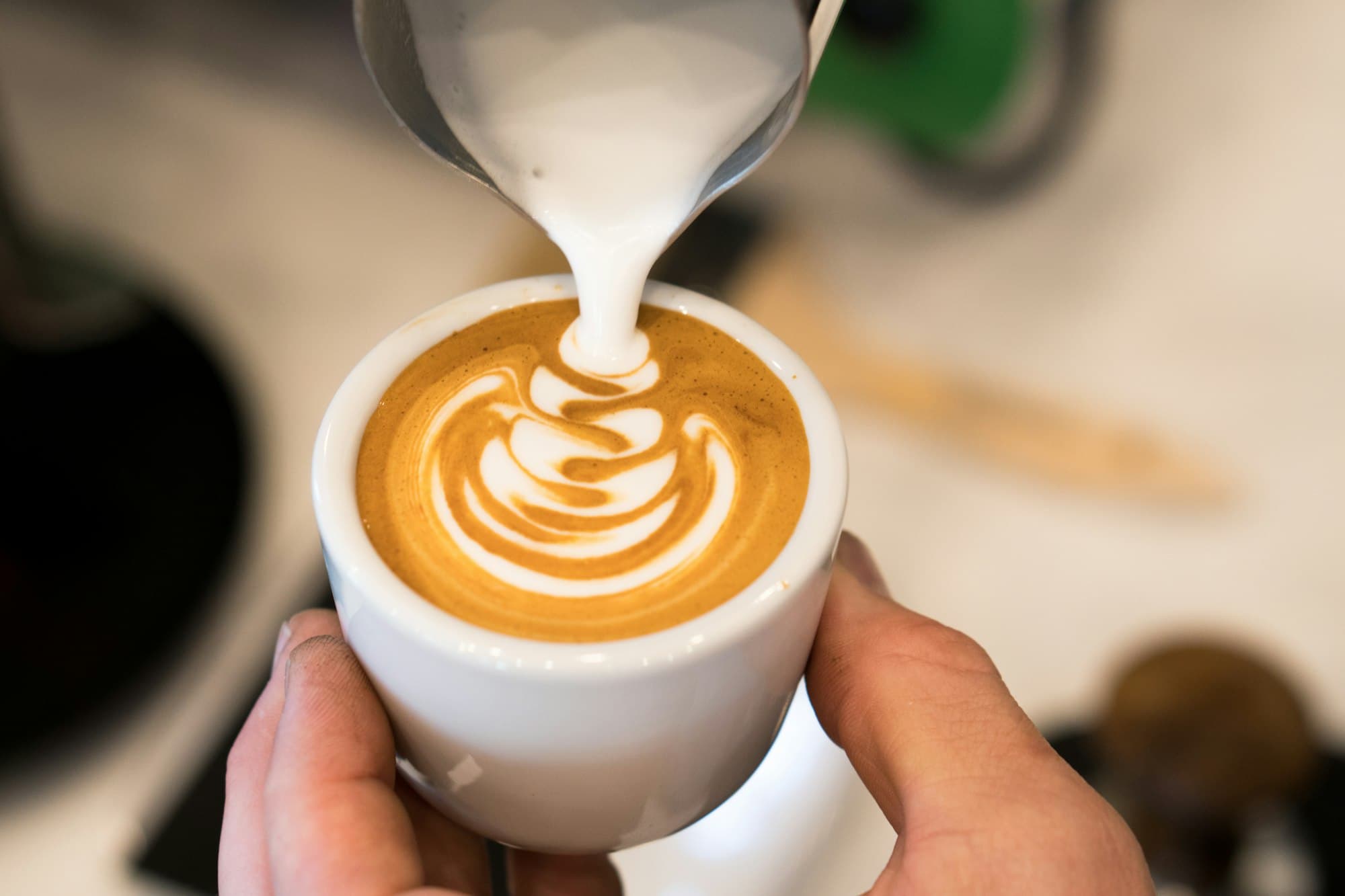 Milk poured into a cappuccino