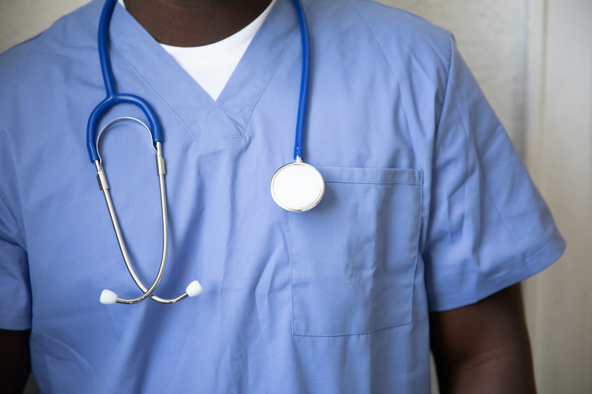 Nurse in blue scrubs with a stethoscope
