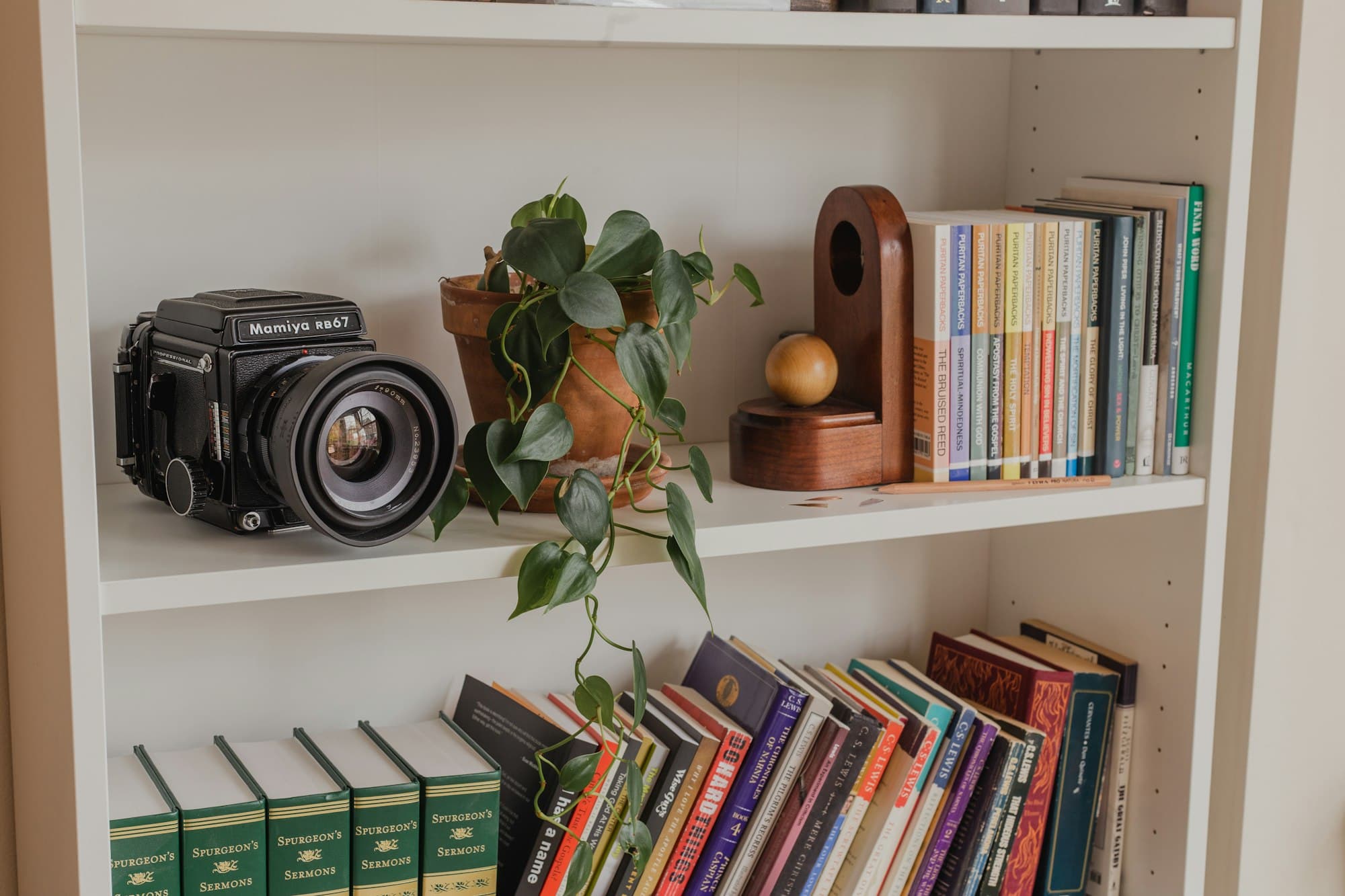 Styled shelf with objects and a camera