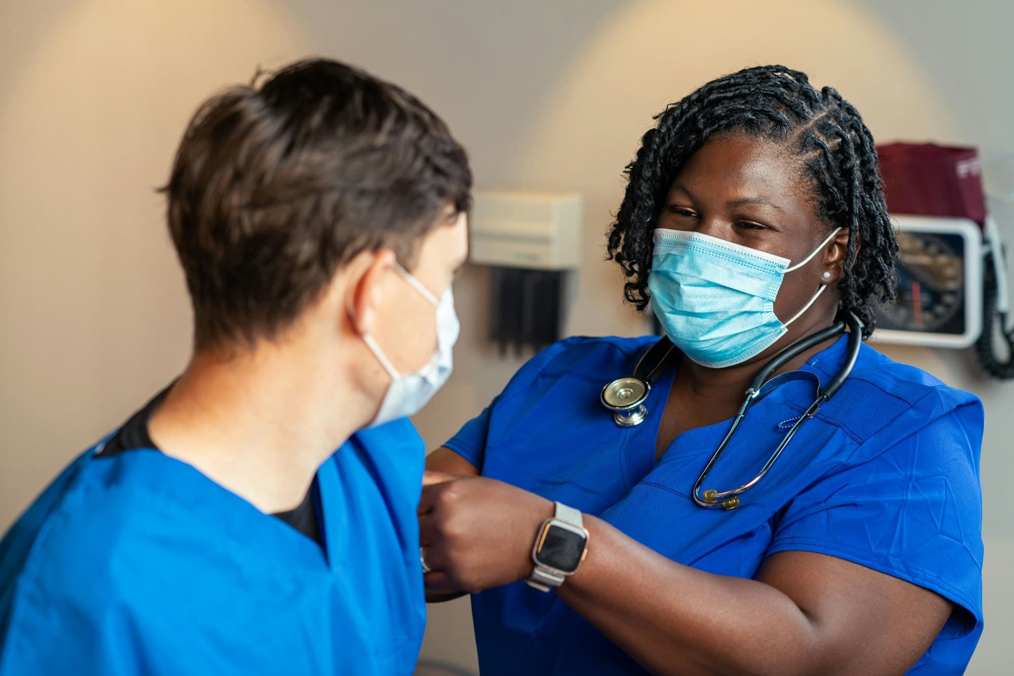 Two nurses talking on a ward